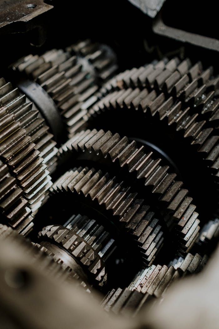 About Detailed close-up of metal gears inside a machine showcasing precision engineering.